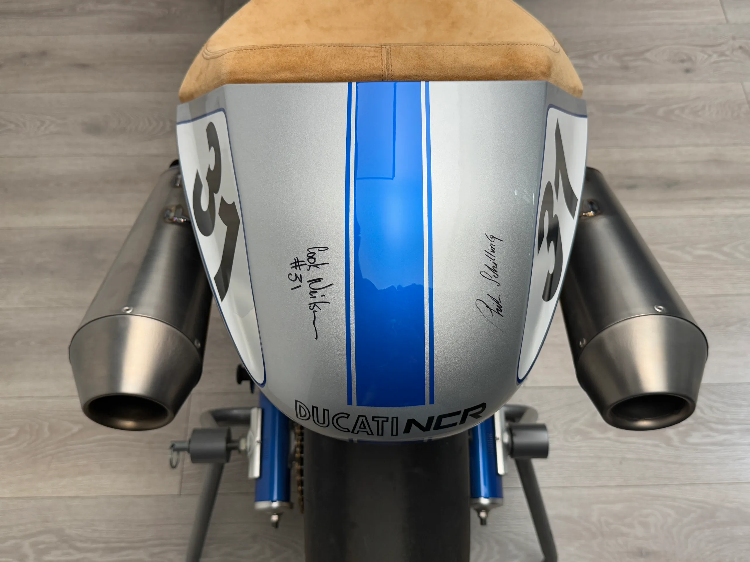 Top-down view of the tail, signed by Cook Neilson and Phil Schilling, twin titanium exhausts either side
