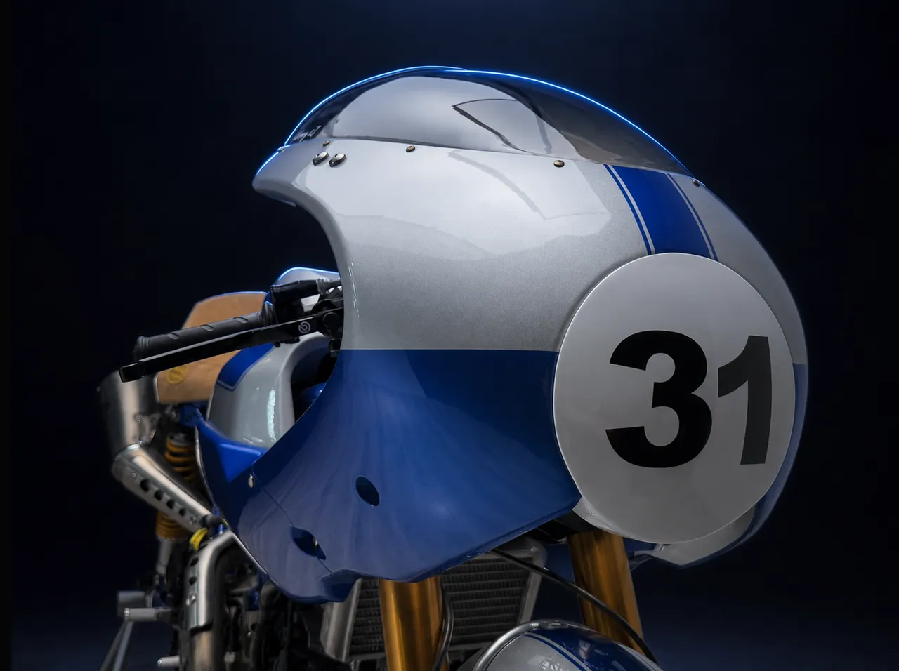 The spare fairing on number twelve, its race number 31 filling the frame