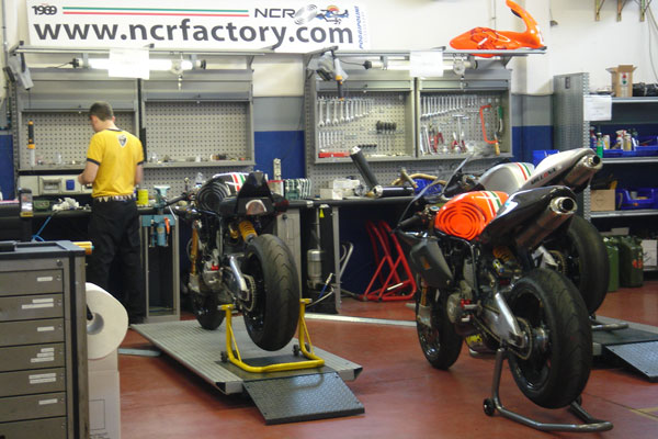 The NCR workshop floor, a machine on the bench under the shop lights